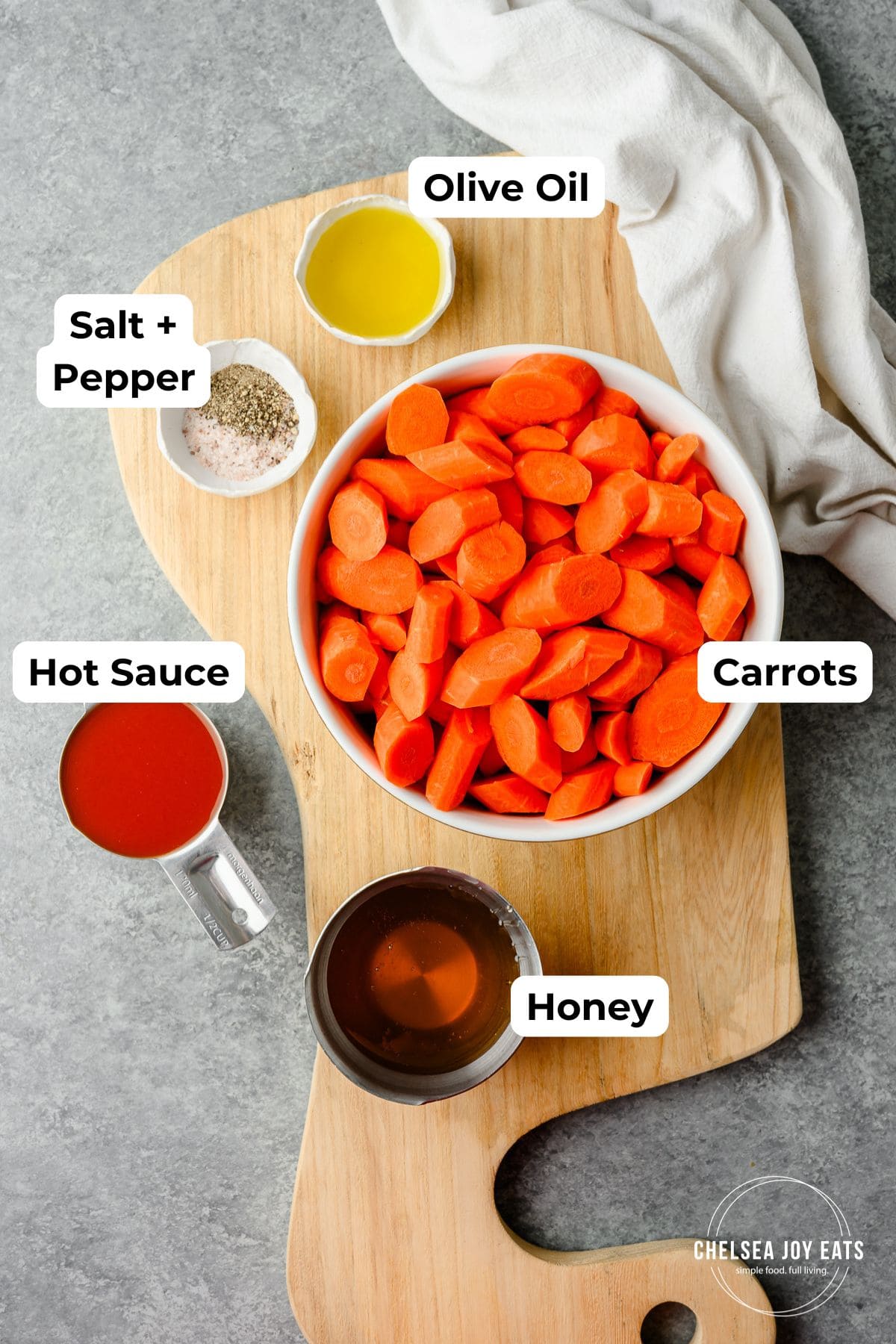 Ingredients for hot honey glazed carrots with labels