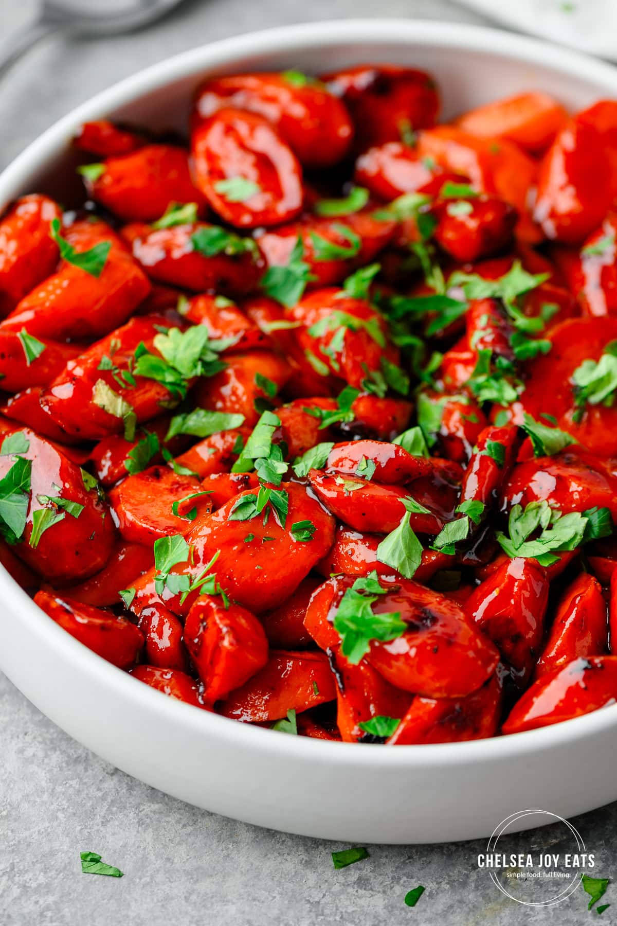 Closeup of carrots glazed with a hot honey sauce and garnished with parsley