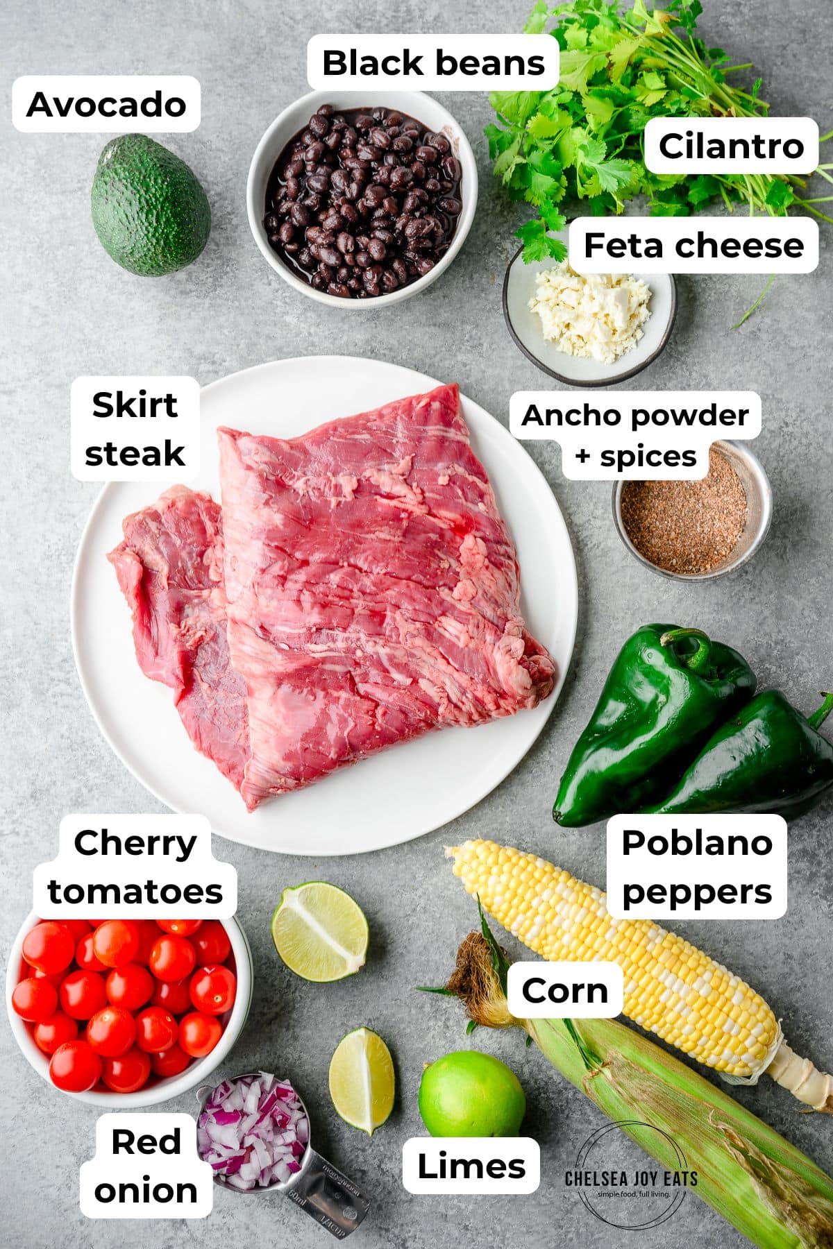 Ingredients for ancho skirt steak bowls with poblano corn salsa, with text labels for each ingredient