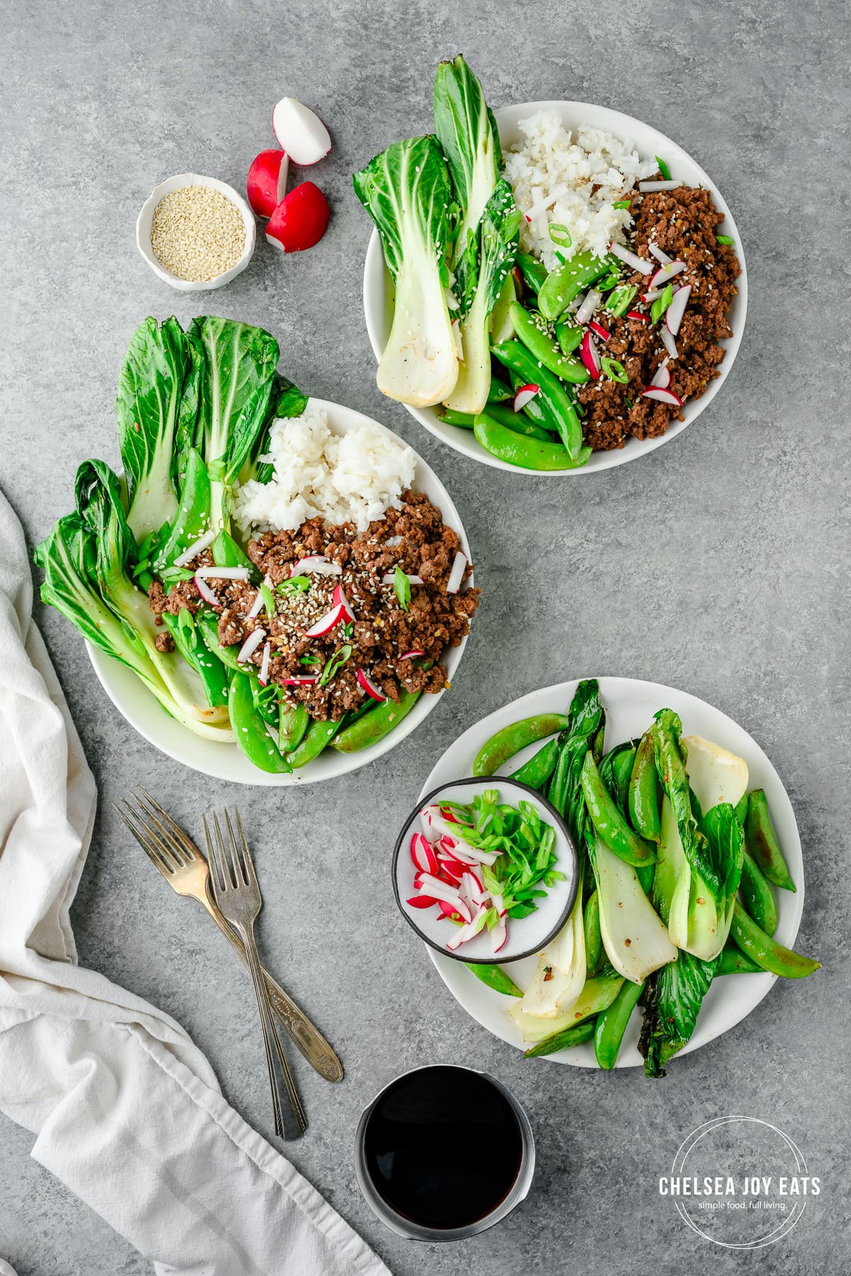Overhead view of ground beef teriyaki bowls served with rice, Bok choy, and snap peas