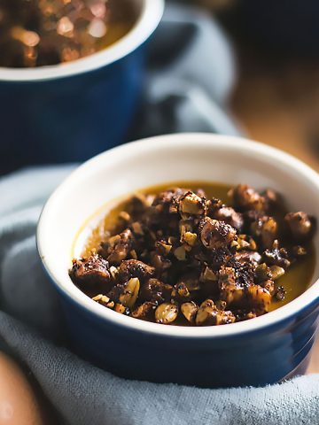 A single-serve dairy free pumpkin custard topped with spiced toasted nuts