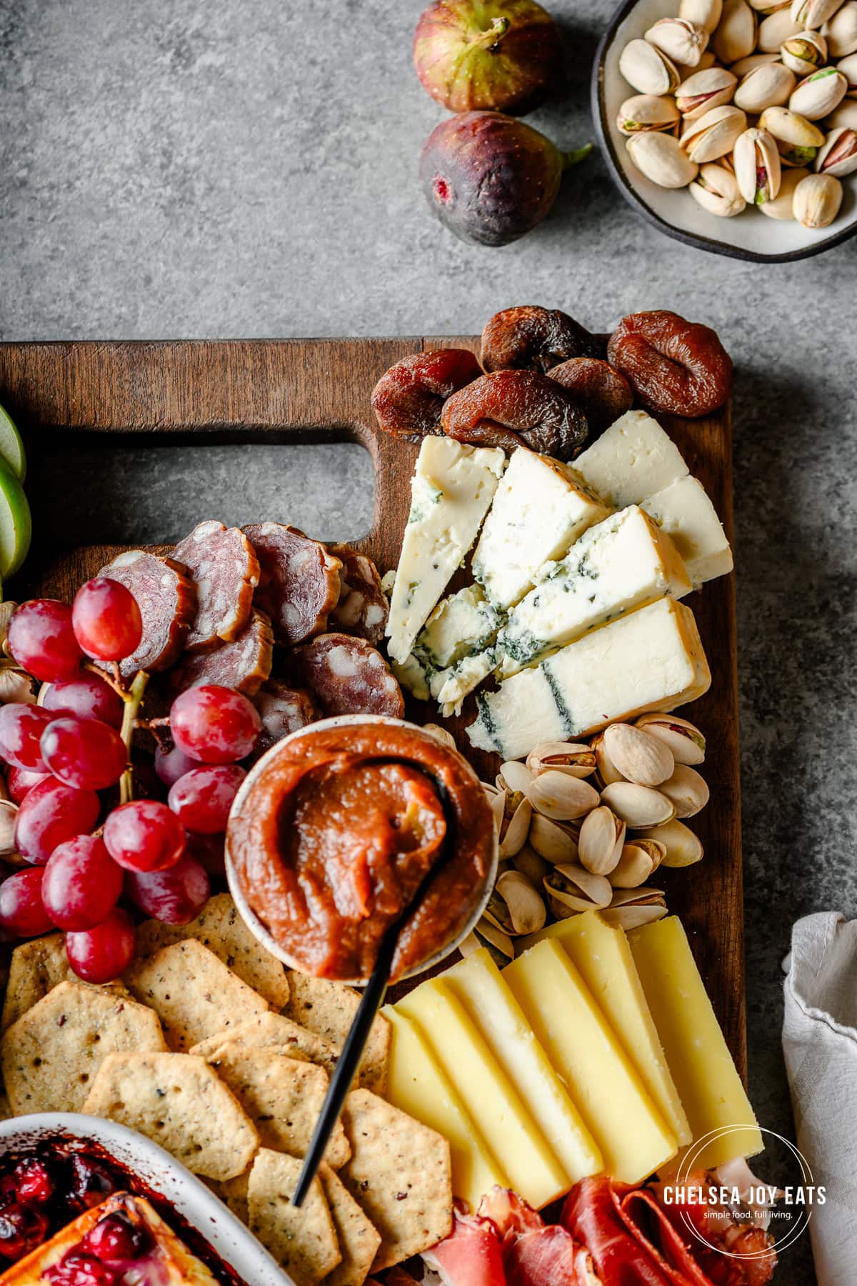 Closeup of a fall-inspired charcuterie board with apple butter and blue cheese