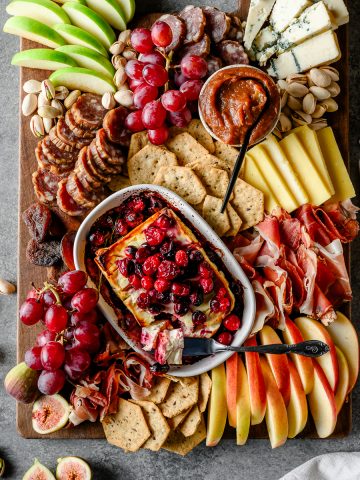 Fall-themed charcuterie board with seasonal produce