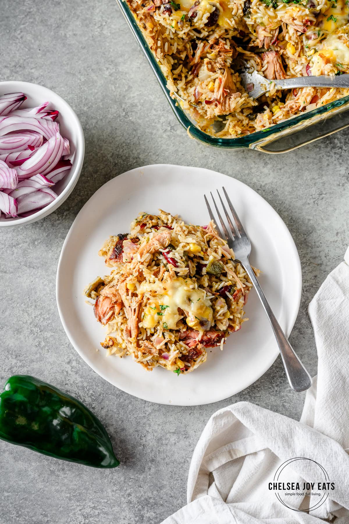 Serving of leftover pulled pork on a plate, topped with cheese