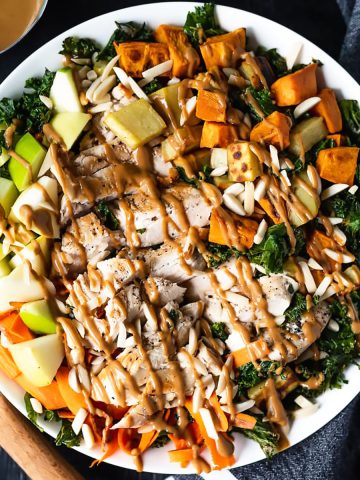 Fall apple and sweet potato salad with kale, chicken, and nutty dressing