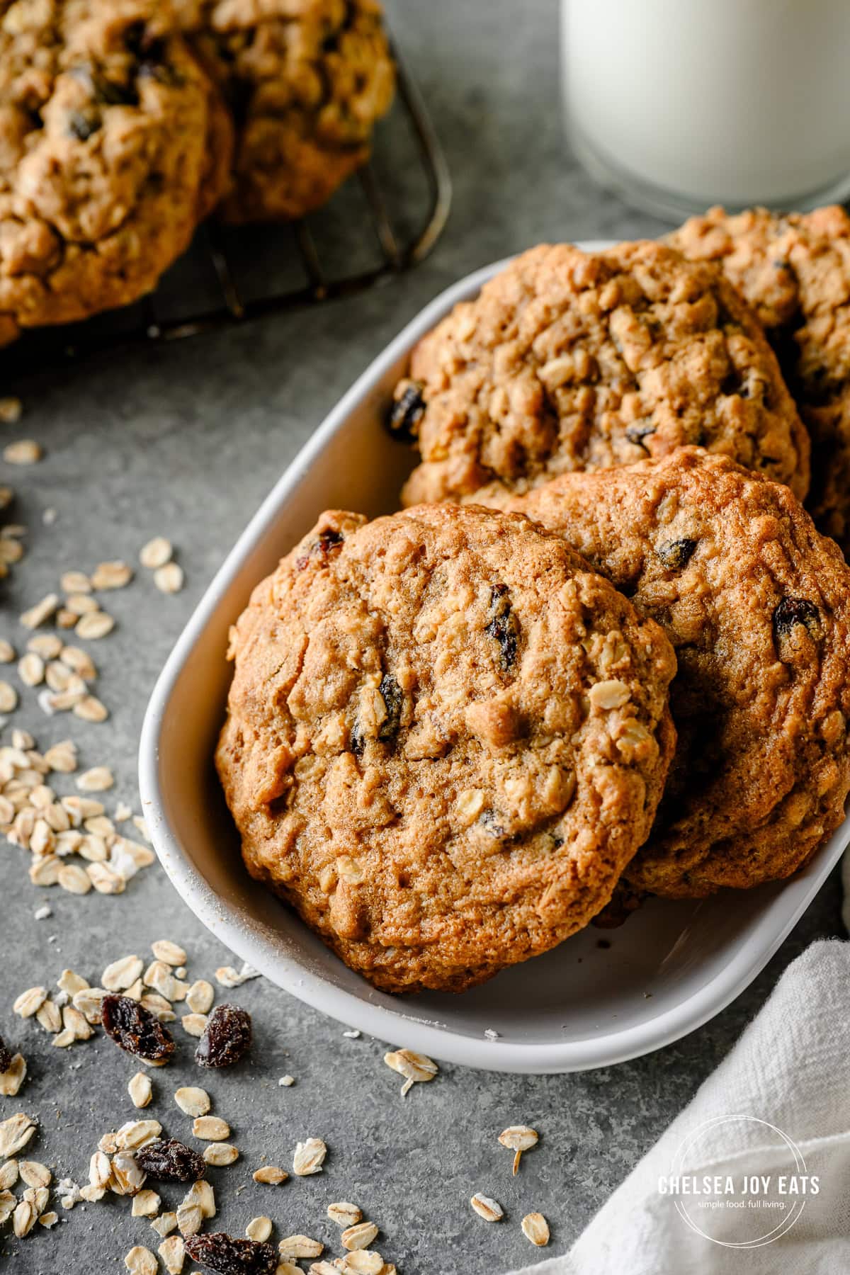 Closeup of a stack of gluten free oatmeal raisin cookies in a serving dish