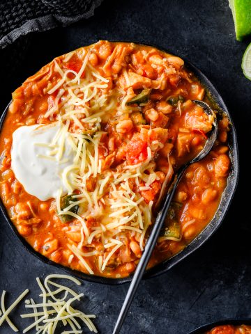 Gluten Free Turkey and Pumpkin Chili garnished with sour cream and cheese
