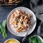 Serving of Turkey Wild Rice Casserole made with leftover turkey, with fresh herbs as garnish