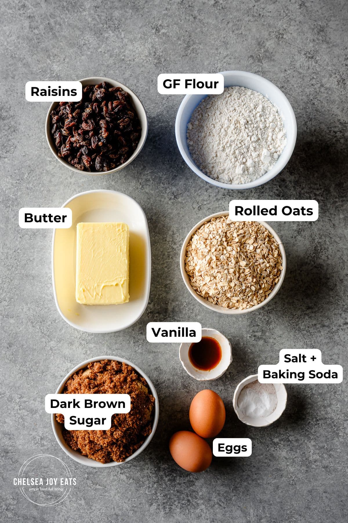 Ingredients for gluten free oatmeal raisin cookies, with text labels for each