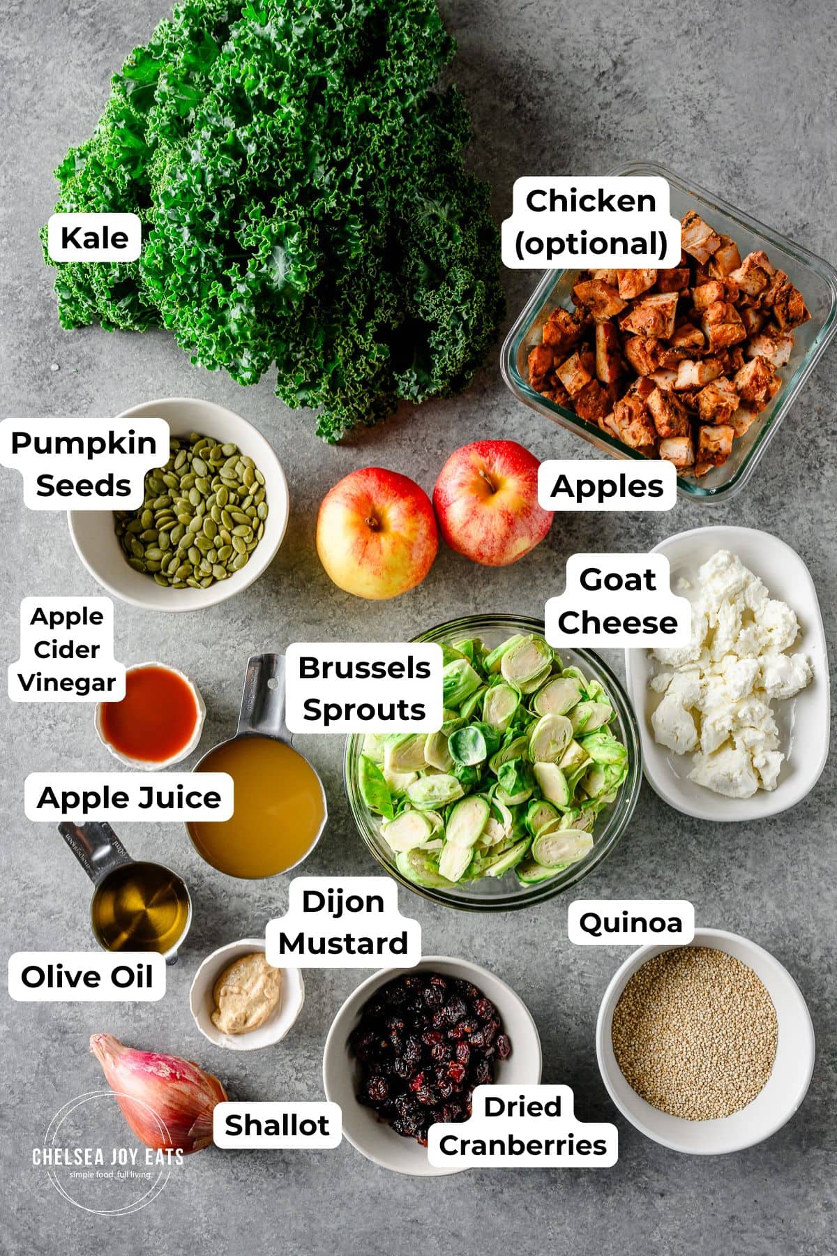 Ingredients for a roasted brussels sprout and quinoa salad with text labels for each ingredient