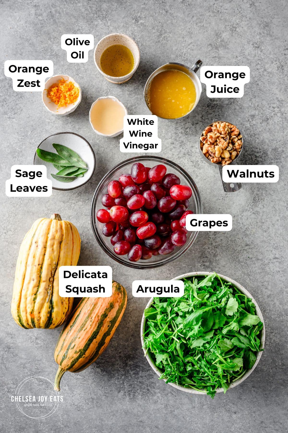 Ingredients for Roasted Grape and Arugula Salad with text labels for each ingredient