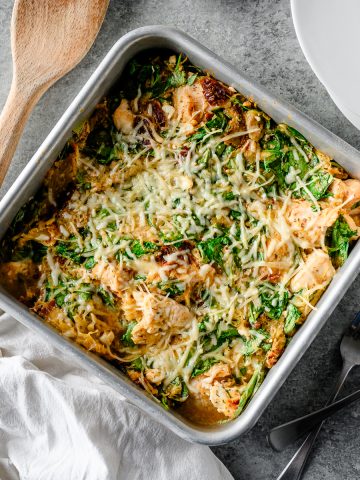 Overhead view of a high protein spaghetti squash casserole with feta, spinach, and chicken