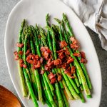 Roasted asparagus with crispy bacon and drizzled in maple bacon vinaigrette.
