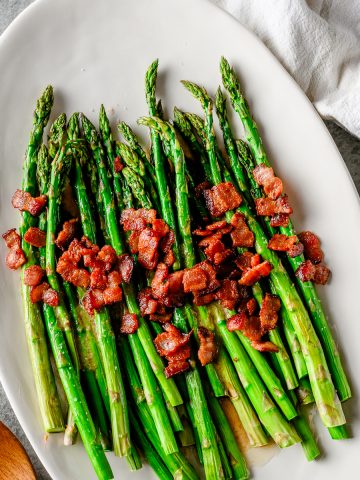 Roasted asparagus with crispy bacon and drizzled in maple bacon vinaigrette.