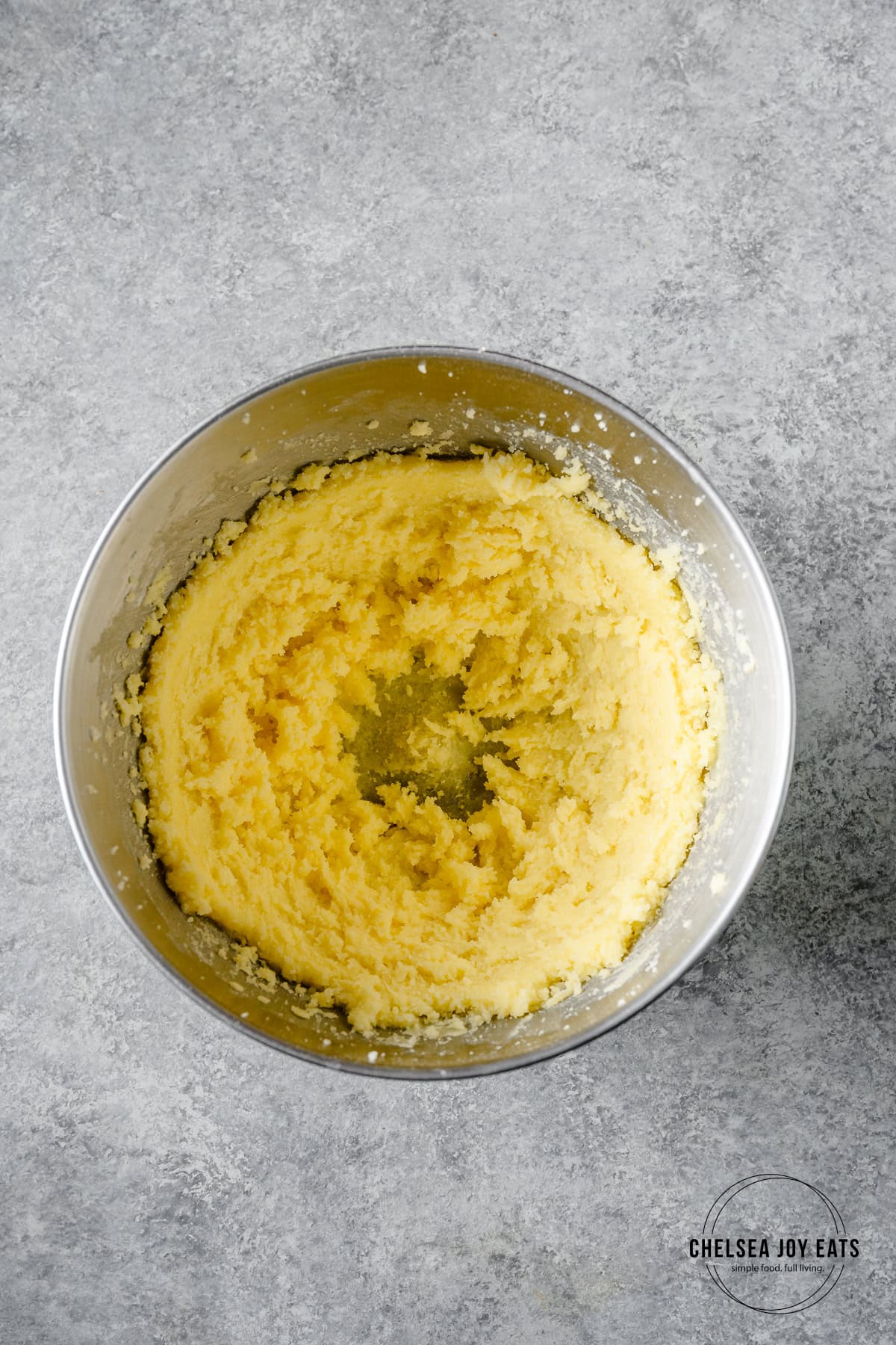 Butter and sogar creamed together in the bowl of a stand mixer.