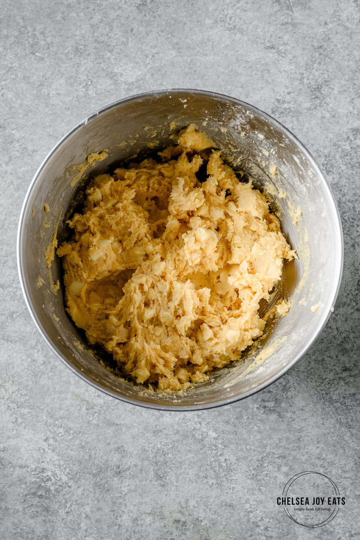 Gluten free cookie dough with macadamia nuts and white chocolate chips stirred in.