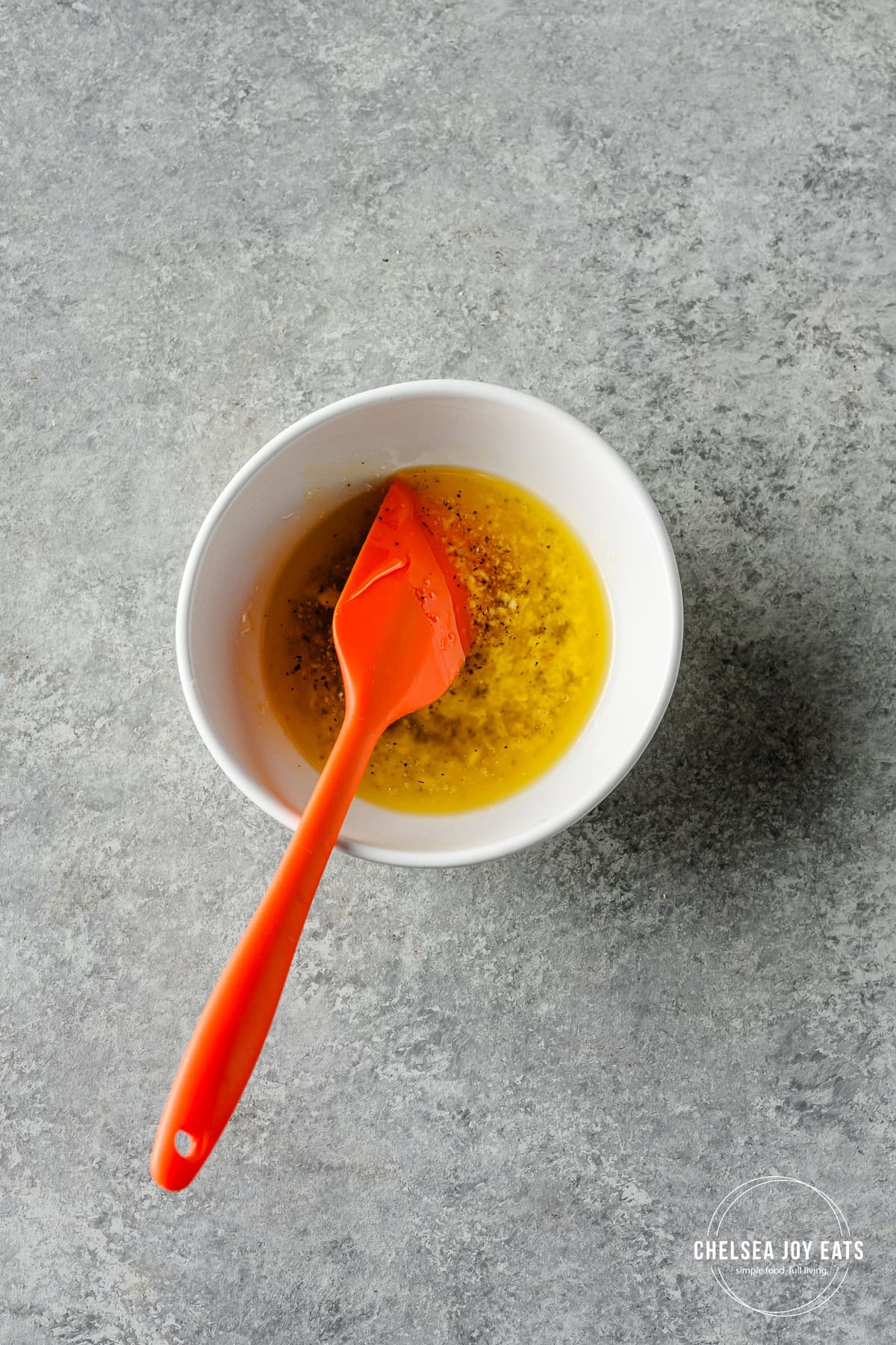 Honey butter glaze stirred in a small bowl.