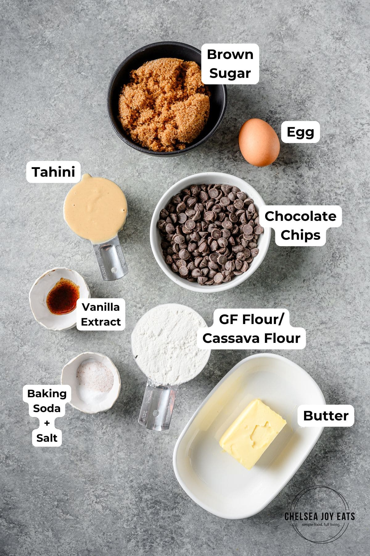 Ingredients for gluten free tahini chocolate chip cookies, with text labels for each ingredient.