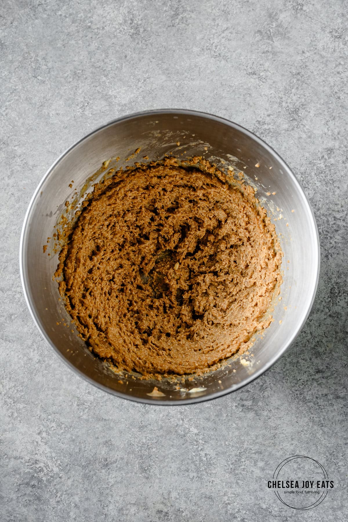 Creamed butter, brown sugar, and tahini in the bowl of a stand mixer.