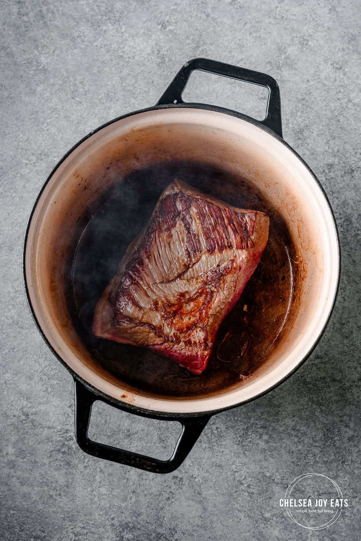 Brisket searing in a Dutch oven.