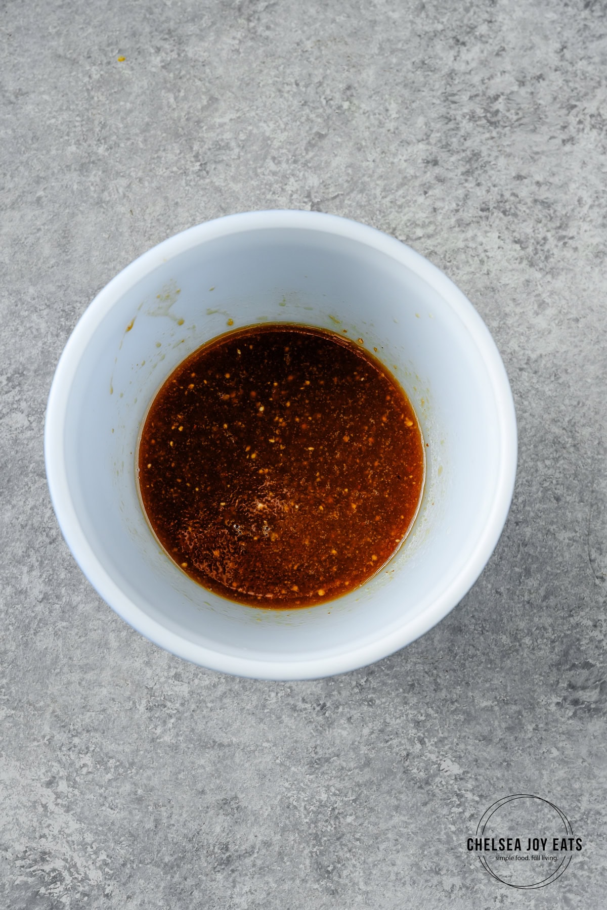 Maple mustard sauce mixed in a small ceramic bowl.