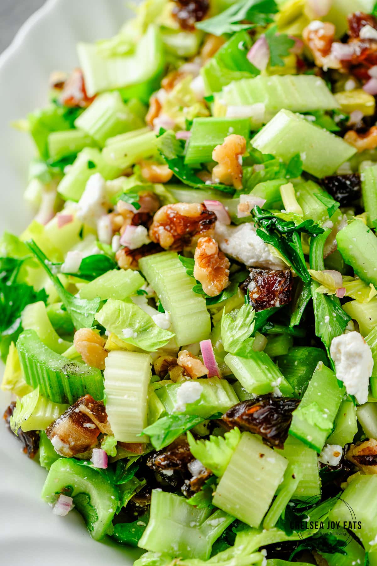 Celery salad with toasted walnuts, parsley, feta cheese, and dates.