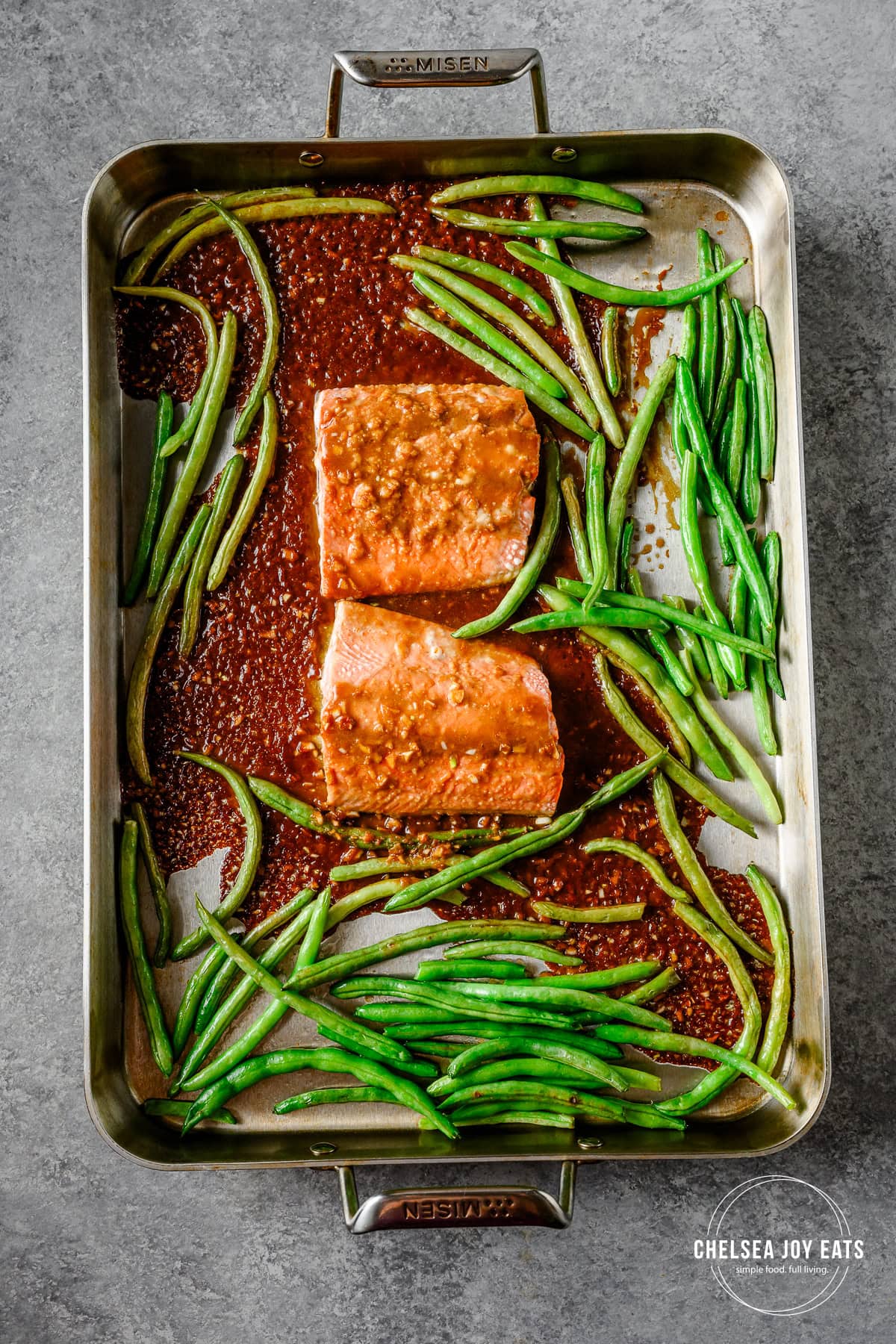 Roasted ginger miso salmon and green beans on a sheet pan.