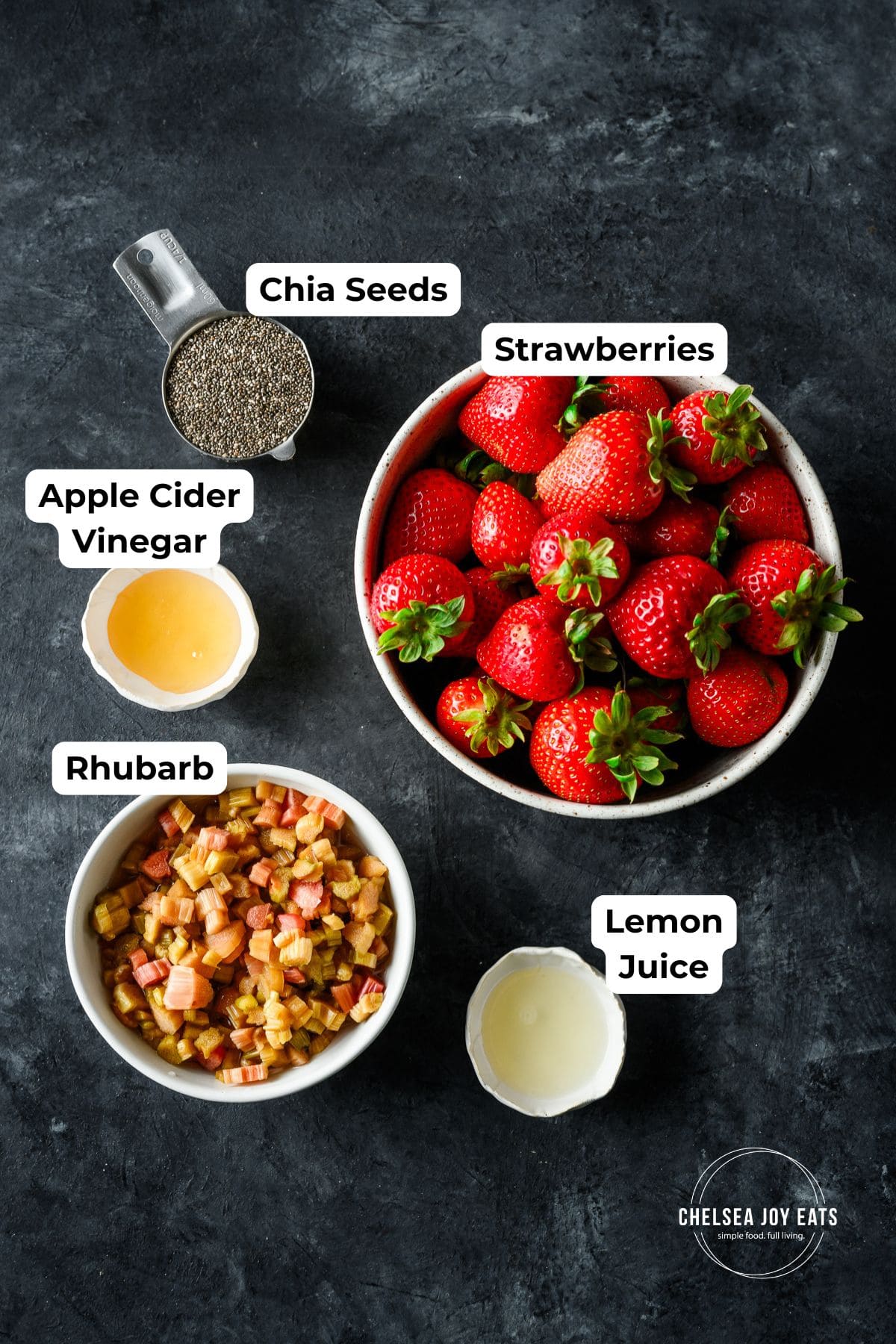Ingredients for strawberry rhubarb chia seeds jam in individual containers with text labels for each ingredient.