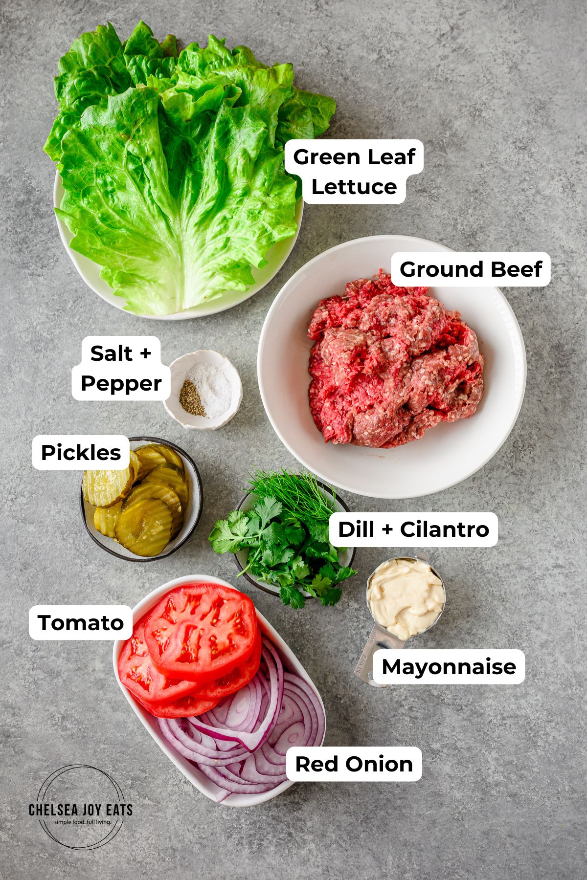 Ingredients for lettuce-wrapped bunless burgers in individual containers with text labels for each ingredient.