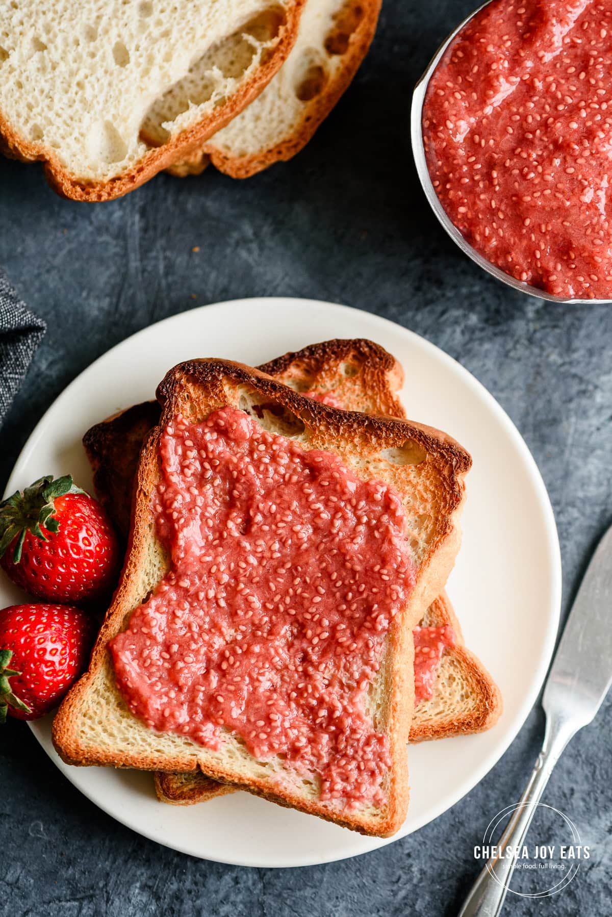 Gluten free toast smeared with paleo strawberry rhubarb chia seed jam.