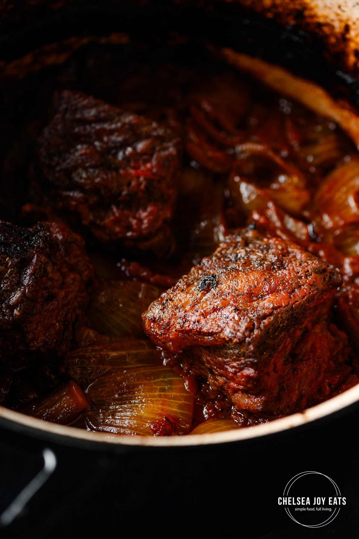 Braised beef short ribs with balsamic vinegar and tomatoes.