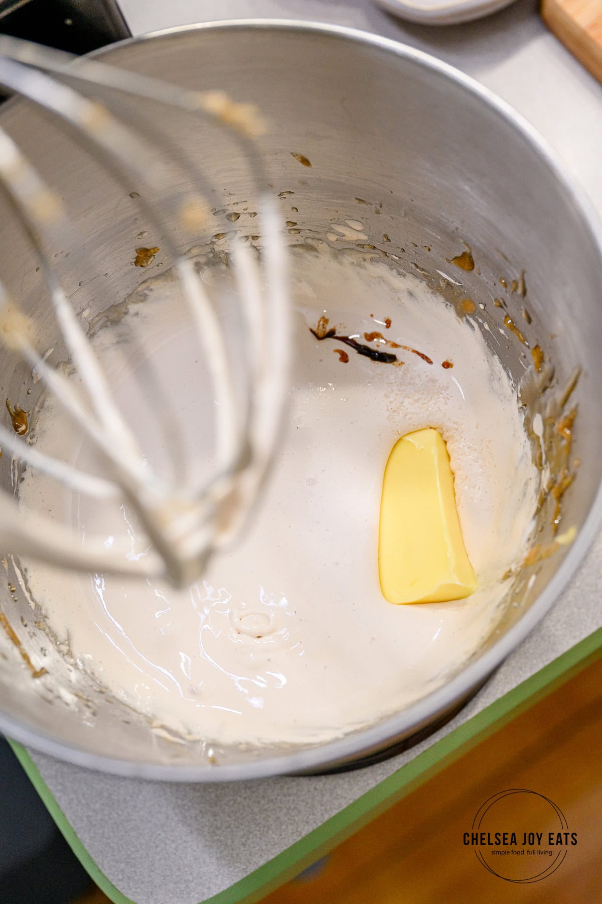 Butter, vanilla extract, and salt in a marshmallow mixture in the bowl of a stand mixer.