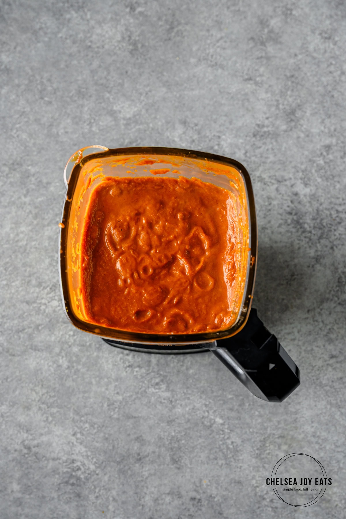 Tikka masala curry sauce blended in the carafe of a blender.
